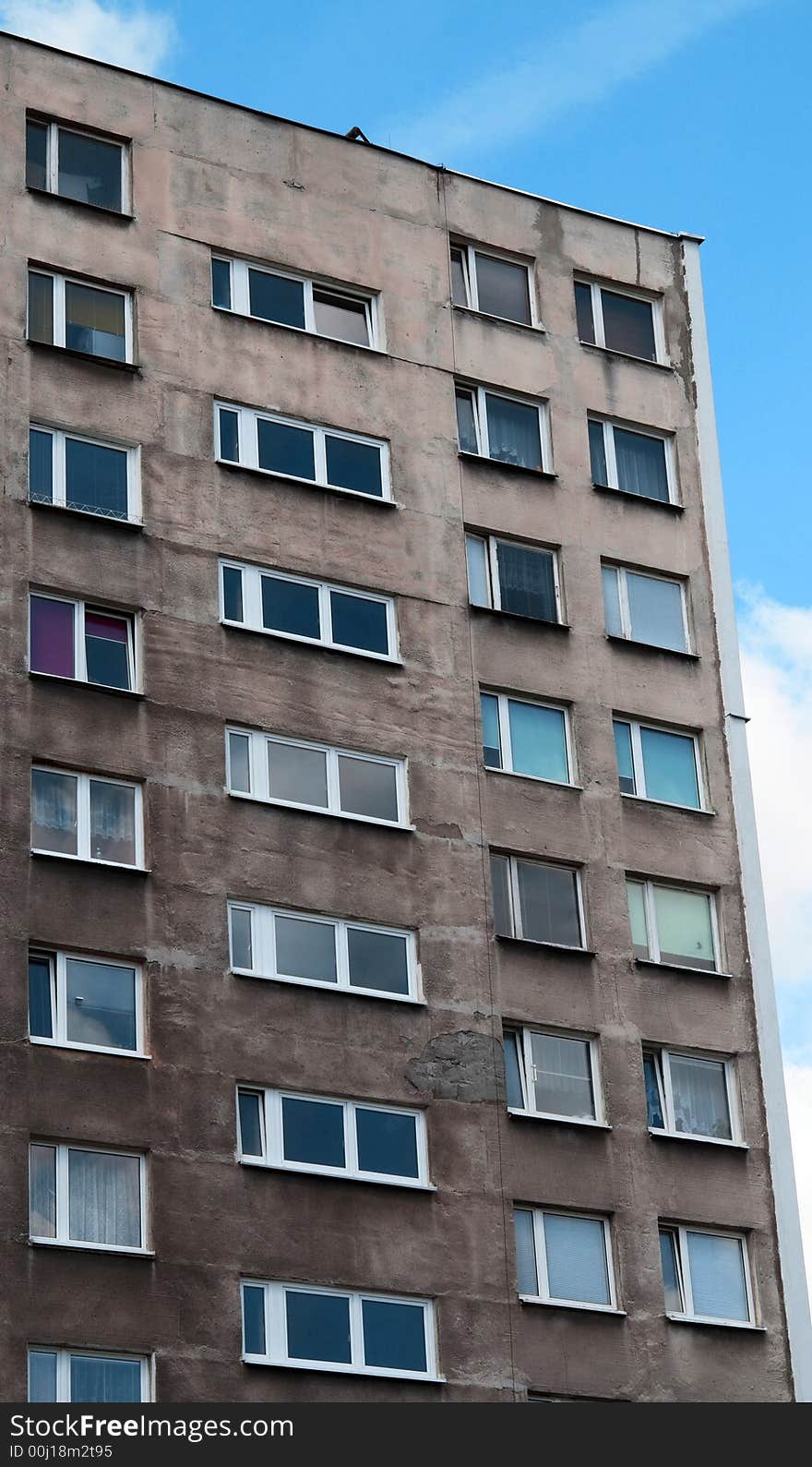 High rise building with blue sky behind