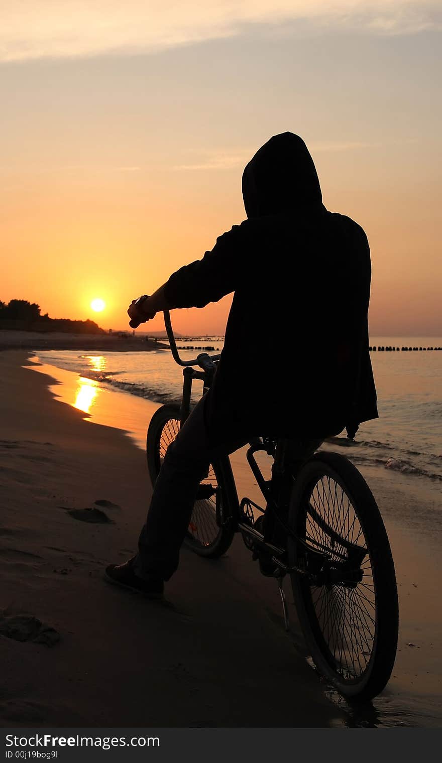 Biker admiring sunrise