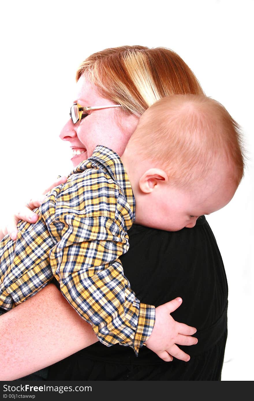 Mommy getting a big hug from her baby boy. Mommy getting a big hug from her baby boy