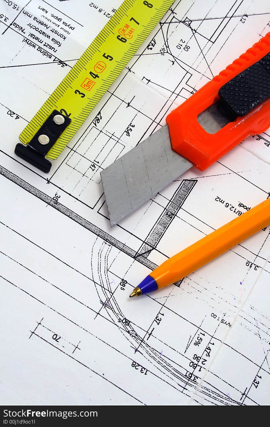 Ruler, penknife and pencil on a blue prints. Ruler, penknife and pencil on a blue prints