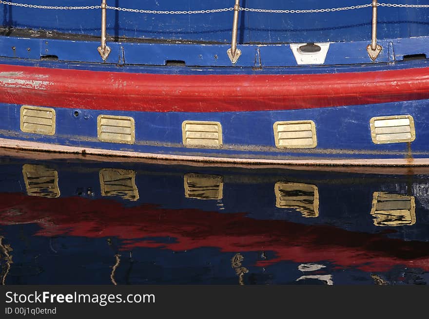 Colorful old riverboat reflections on water