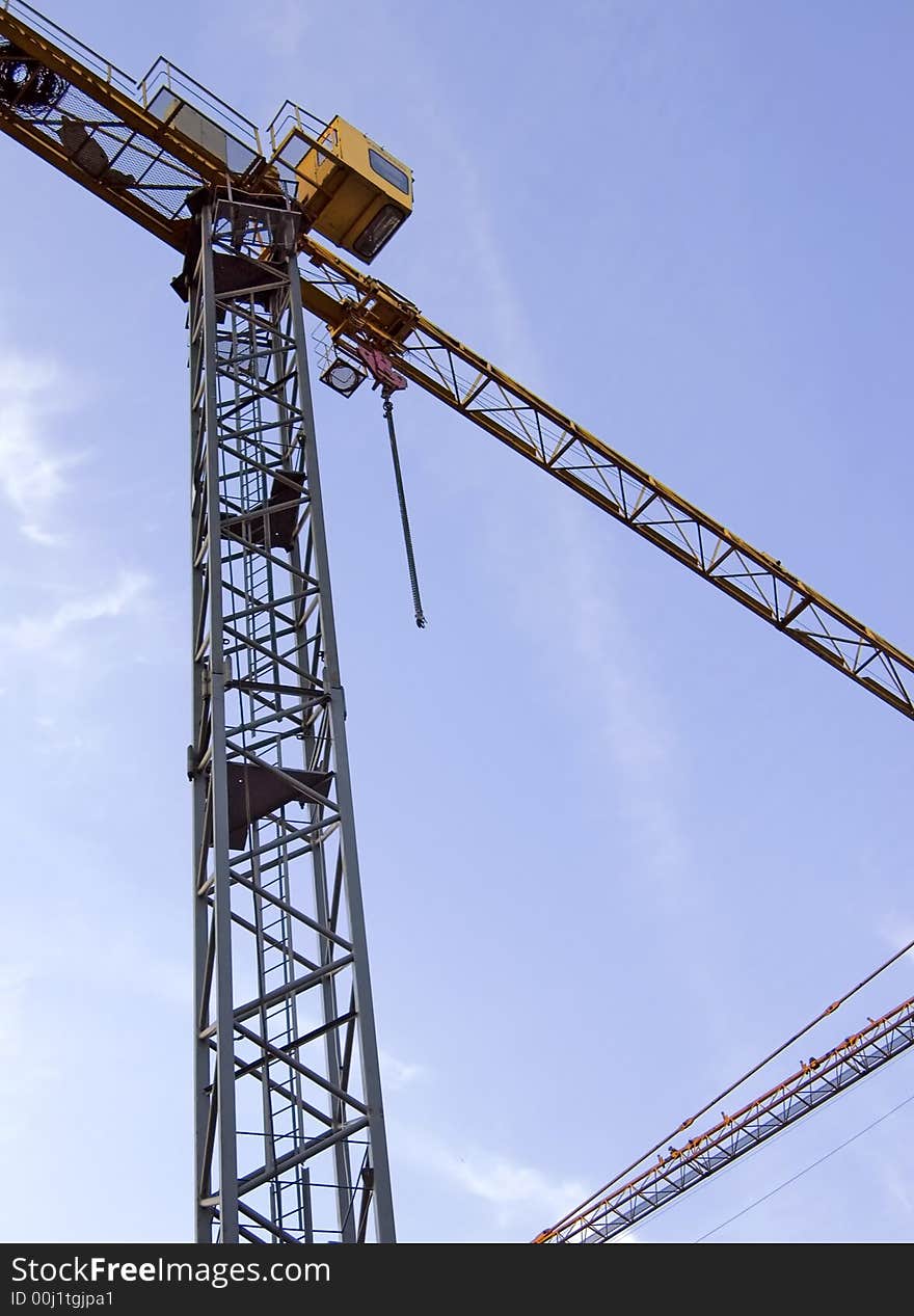 The building crane on a background of the sky. The building crane on a background of the sky