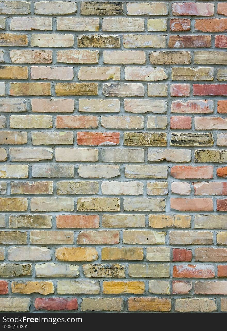 Multi-color brick wall of a house. Multi-color brick wall of a house.