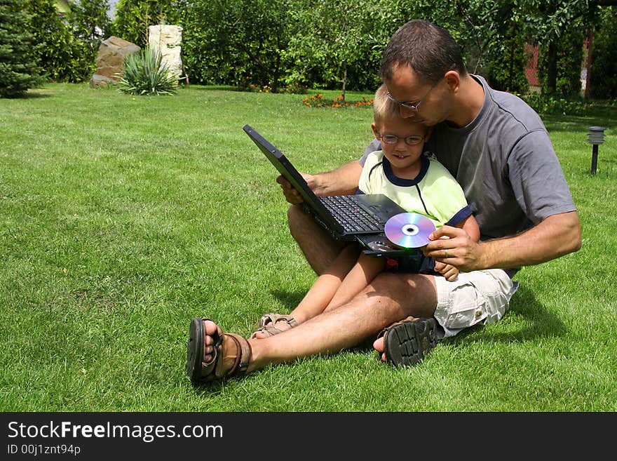 Father And Son With A Computer