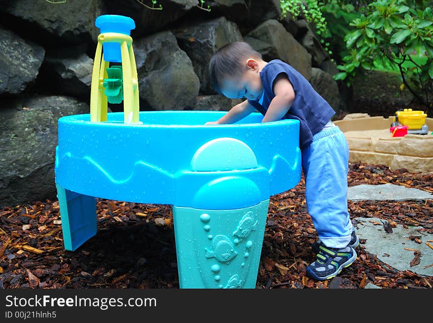 Child Playing in Water Activity Table. Child Playing in Water Activity Table