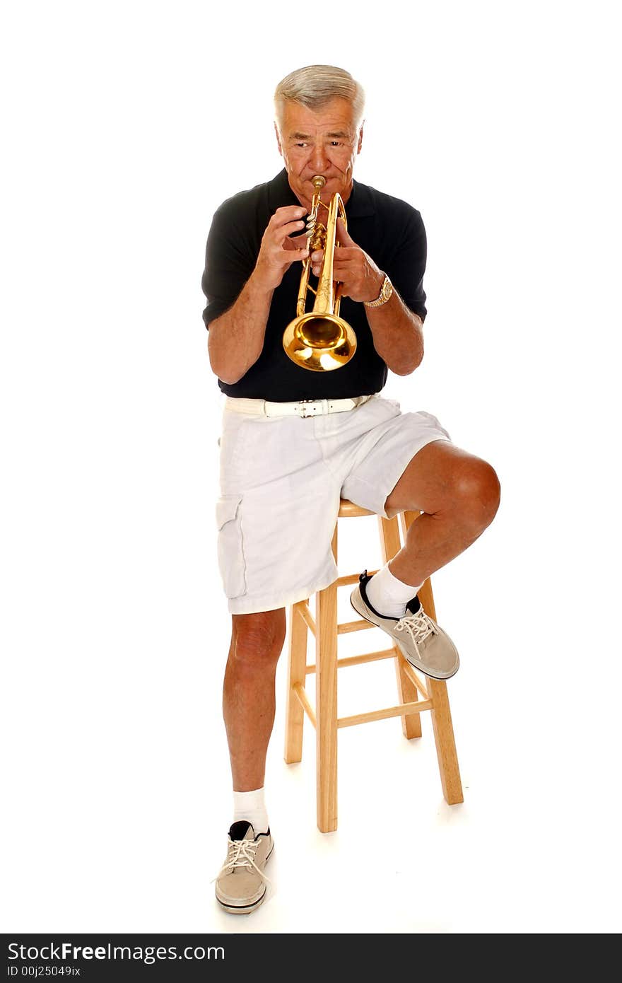 Full body view of a senior man playing his trumpet.  Isolated on white. Full body view of a senior man playing his trumpet.  Isolated on white.