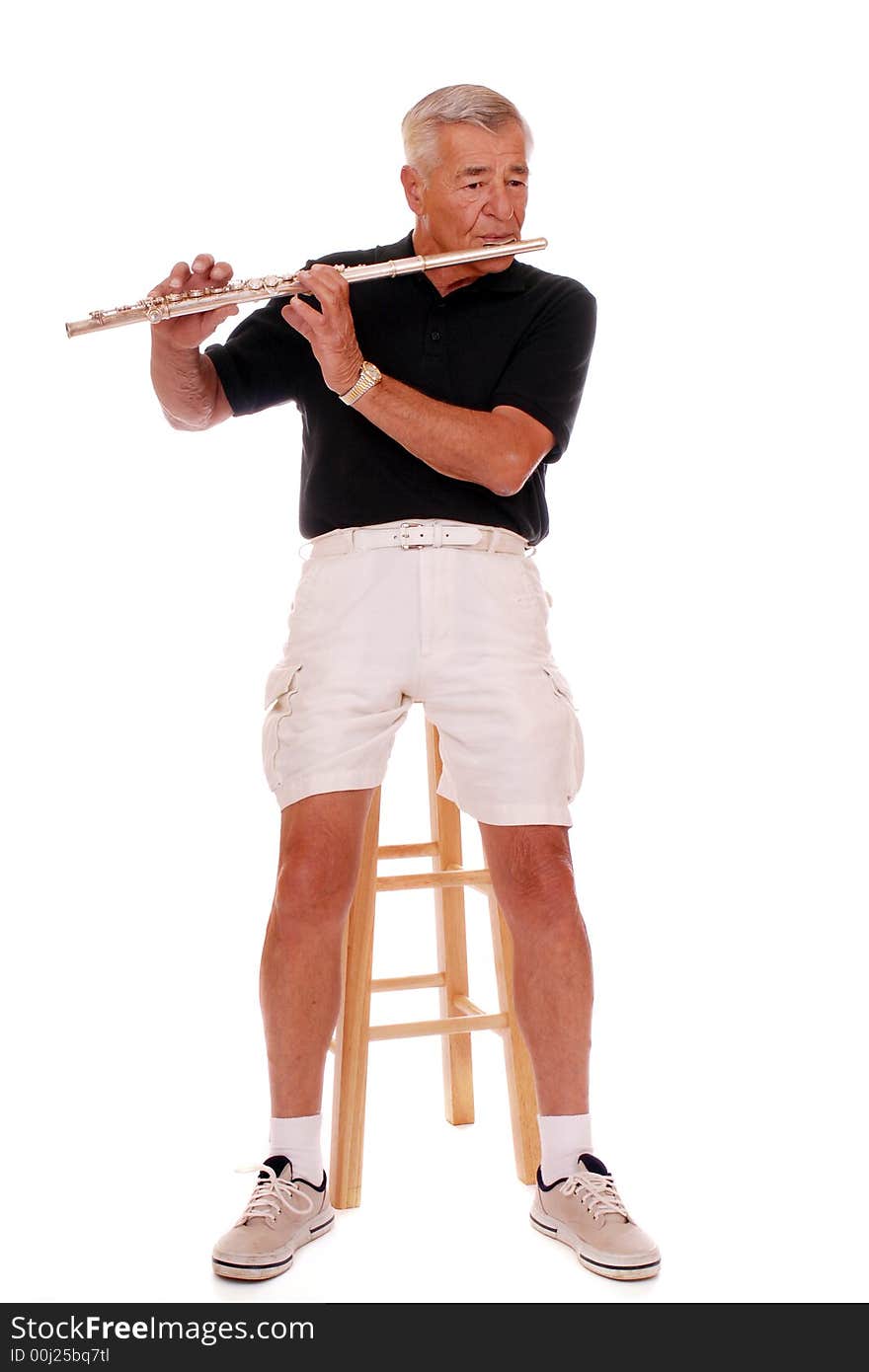 Full body portrait of a senior man playing his flute.  Isolated on white. Full body portrait of a senior man playing his flute.  Isolated on white.