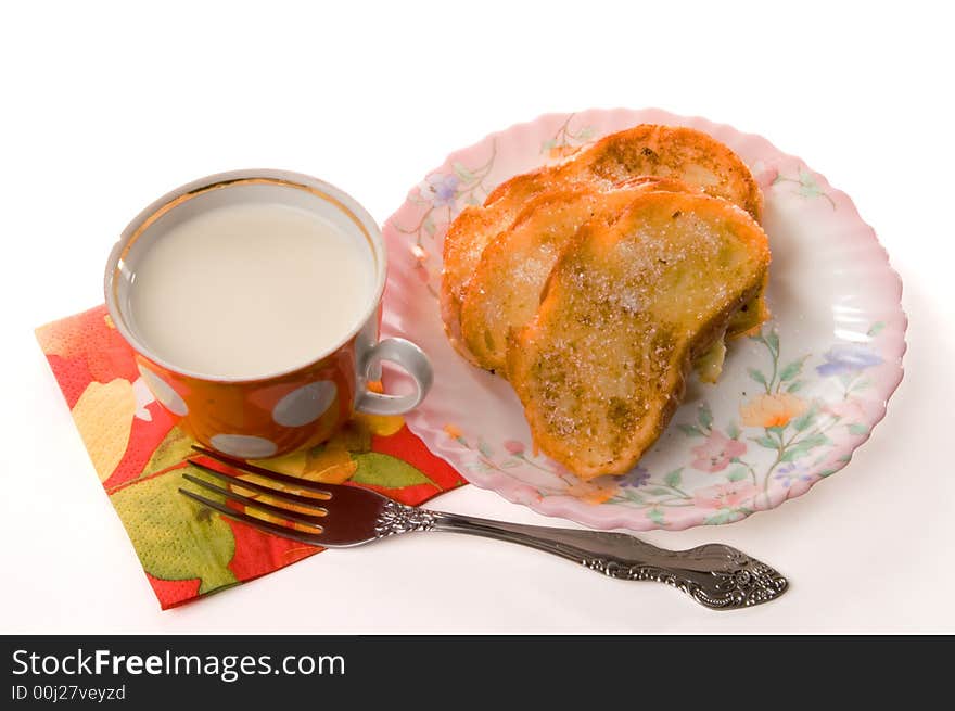 Toast and milk on a china plate