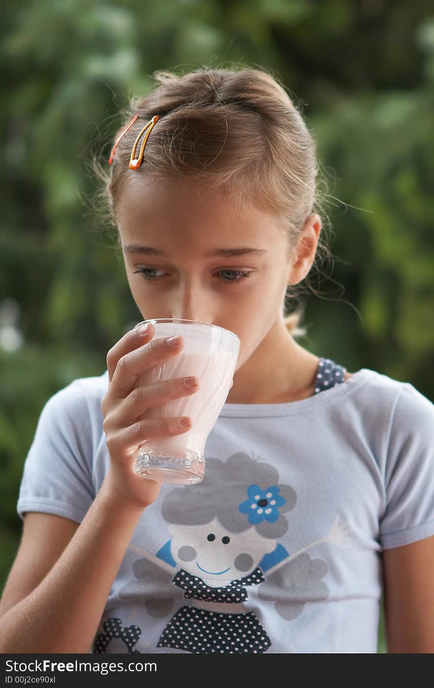 Girl drinking milk from the glass