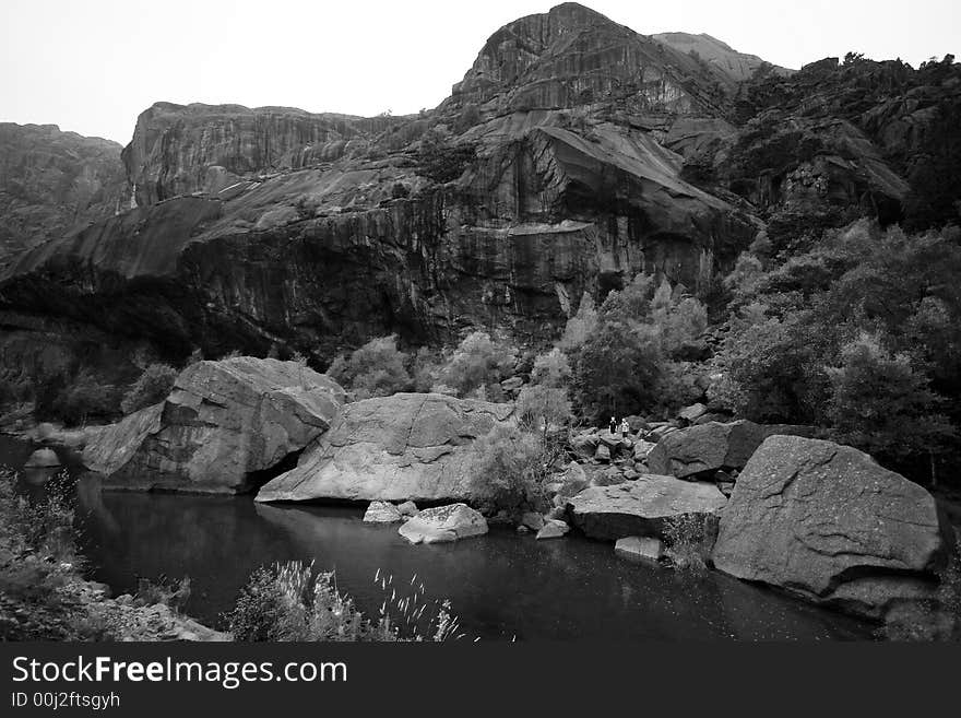 Massive Norwegian mountain and a river, foggy tops, monochrome photo, two small figures for a sense of scale.

<a href='http://www.dreamstime.com/beauty-of-norway-rcollection5045-resi208938' STYLE='font-size:13px; text-decoration: blink; color:#FF0000'><b>BEAUTY OF NORWAY COLLECTION »</b></a>. Massive Norwegian mountain and a river, foggy tops, monochrome photo, two small figures for a sense of scale.

<a href='http://www.dreamstime.com/beauty-of-norway-rcollection5045-resi208938' STYLE='font-size:13px; text-decoration: blink; color:#FF0000'><b>BEAUTY OF NORWAY COLLECTION »</b></a>