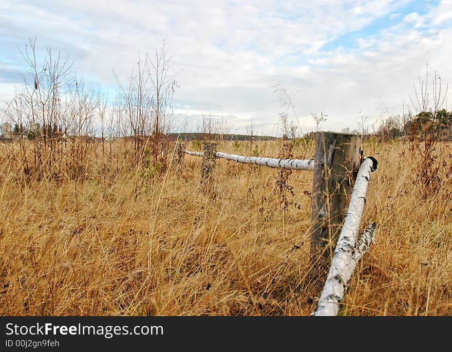 Wooden fencing on a grass in a floor. Wooden fencing on a grass in a floor