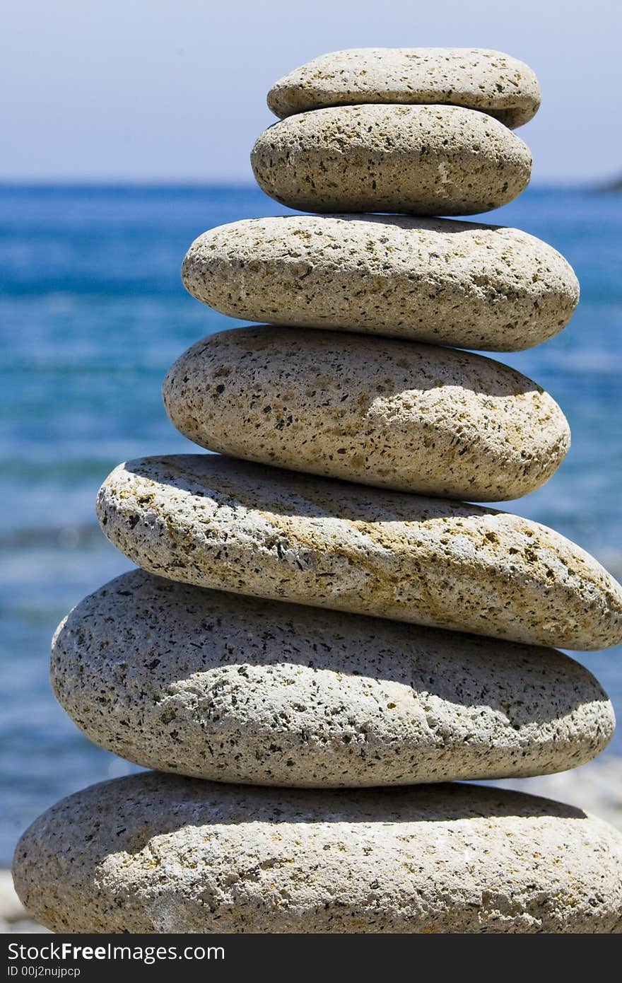 Balancing stones with the sea on the background. Balancing stones with the sea on the background