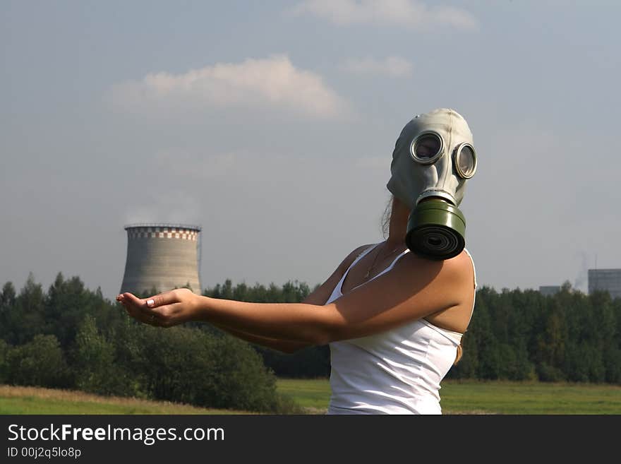 Girl in a gas mask and smoke pipe