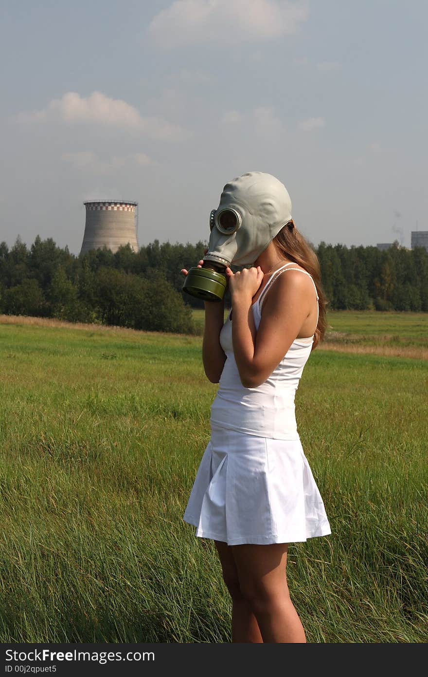 Girl in a gas mask and smoke pipe