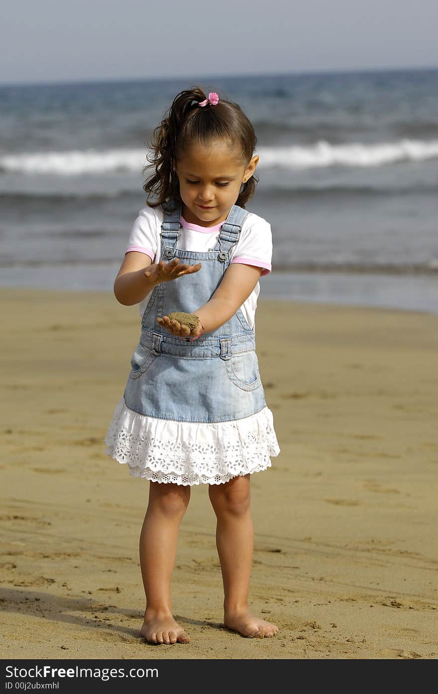 Child playing with sand