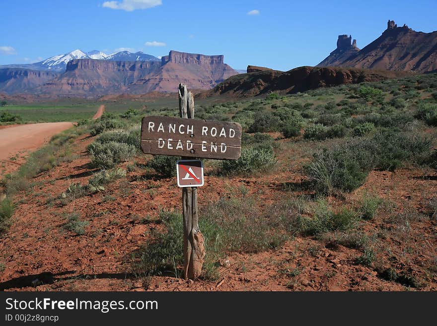 Ranch road Utah dead end w/ mountains background