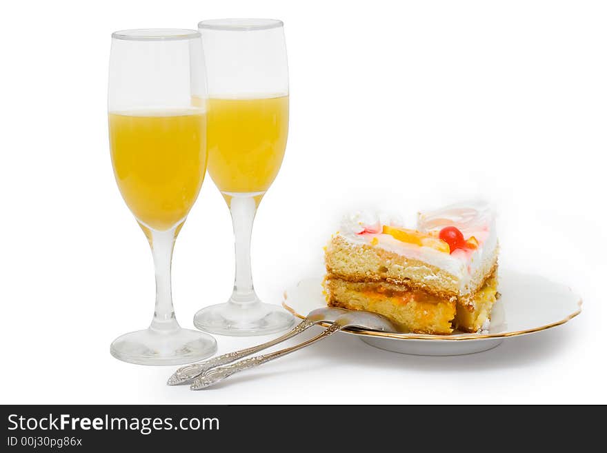 Cake and juice on a white isolated background. Cake and juice on a white isolated background