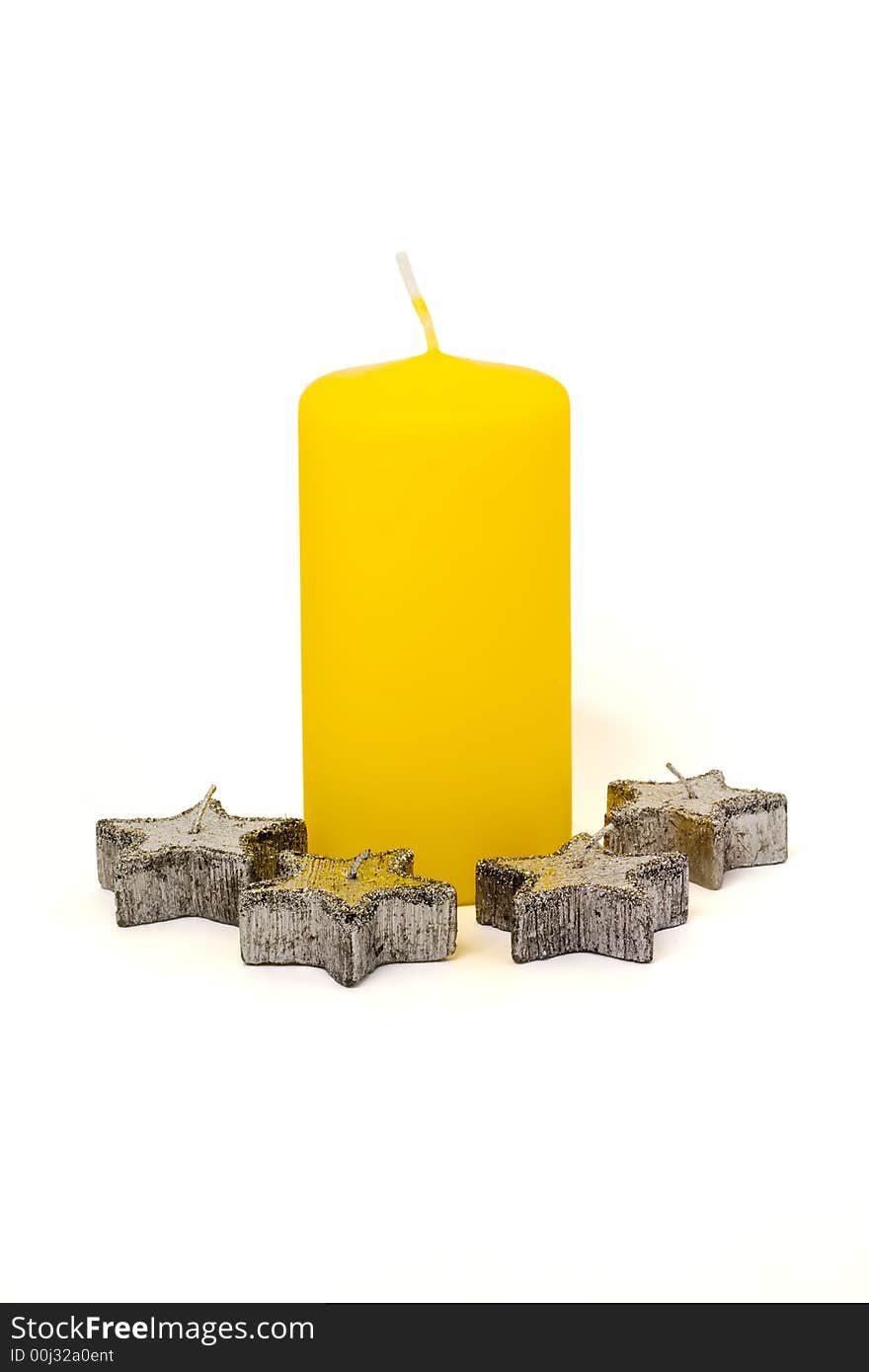 Yellow candle and four silver candles