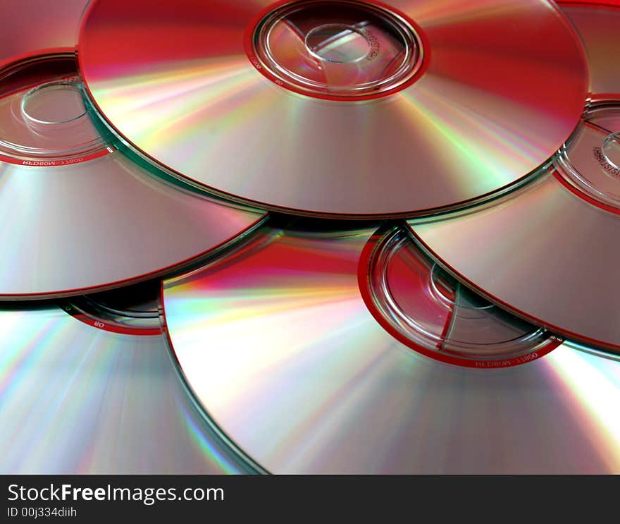 An assortment of compact discs, full frame.