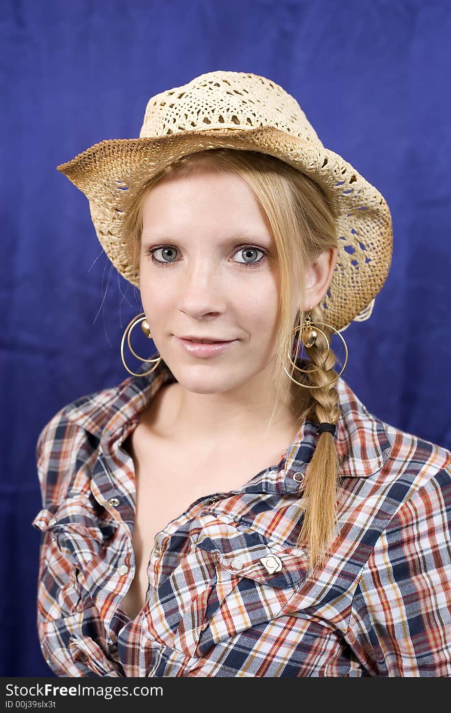 Blond girl in straw hat