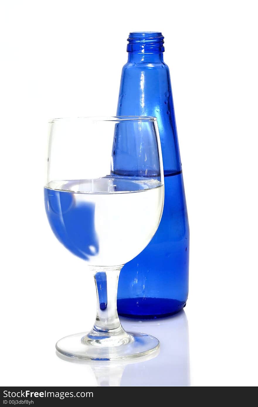 Blue bottle and glass of water. Blue bottle and glass of water