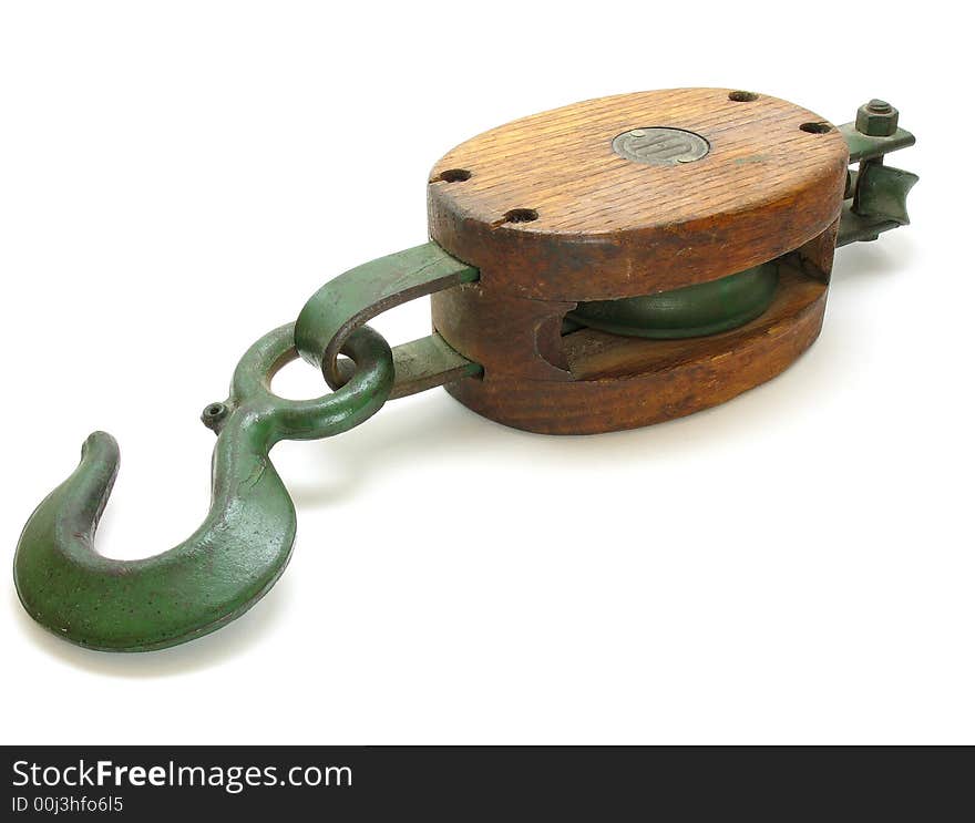 This is an antique pulley and hook shot on a white background. This was taken off of an old ship.