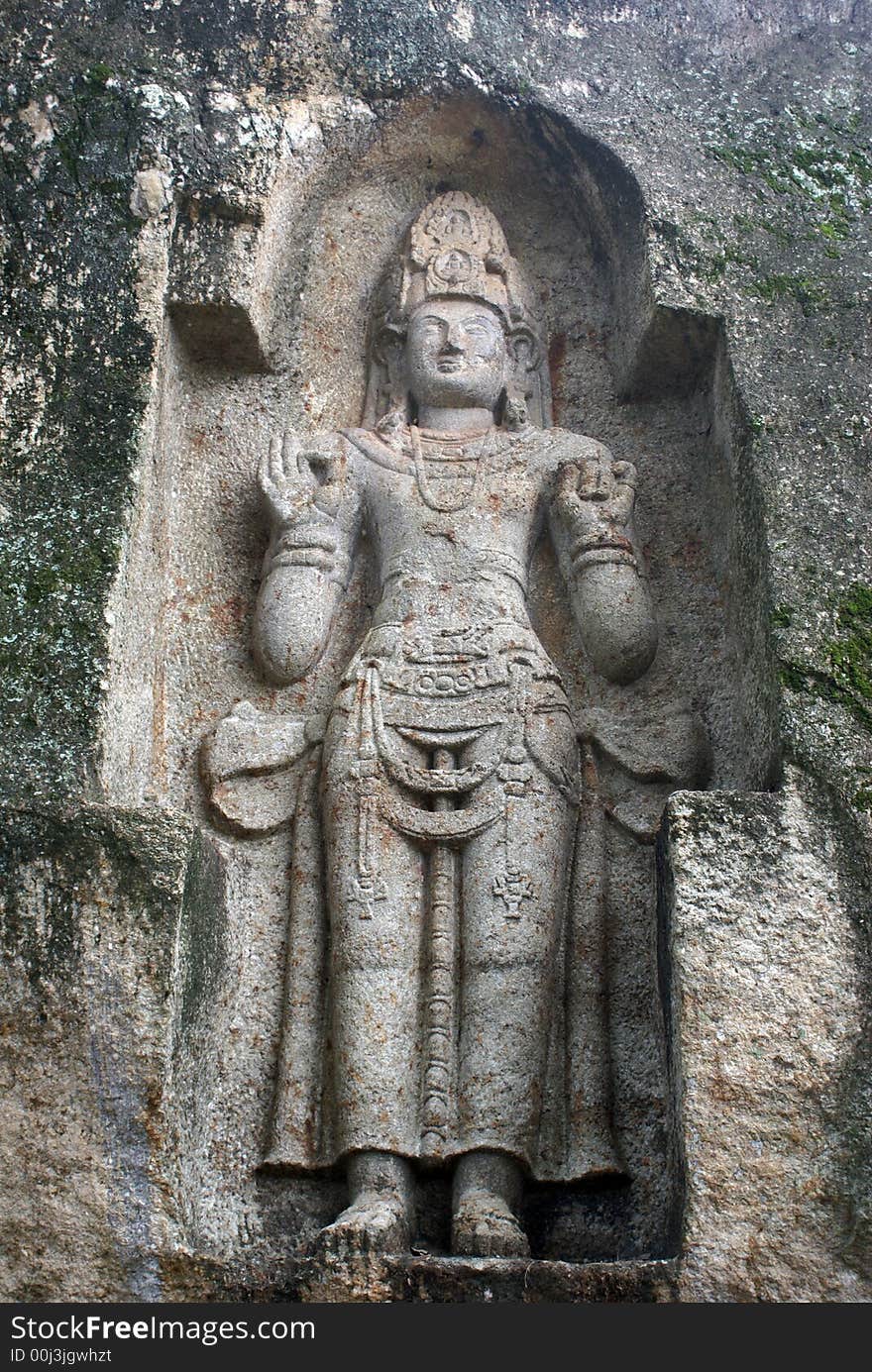 Old rock-carved figure Kustoraja near Weligama, Sri Lanka