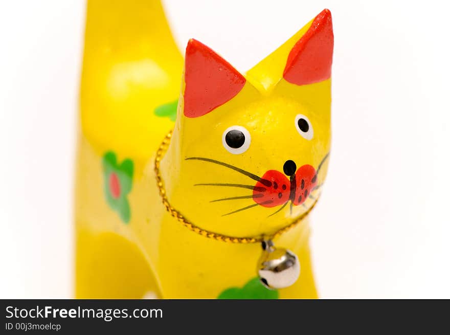 Wooden yellow kitten close up