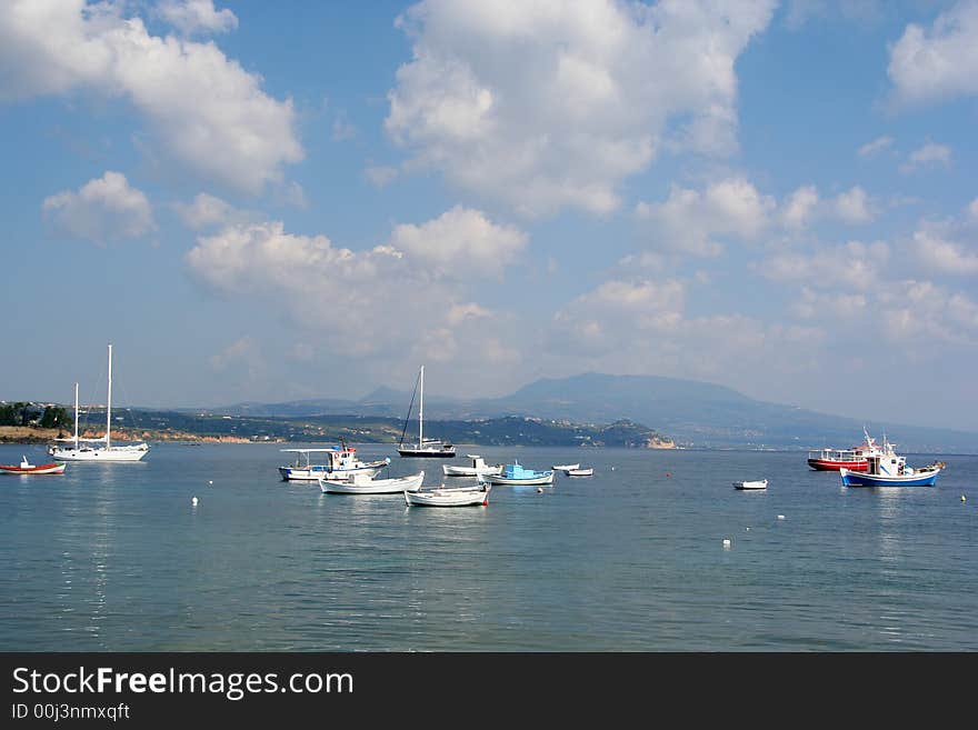 Boat and yachts anchored at the coast of Koroni, Messinia area, Greece. Boat and yachts anchored at the coast of Koroni, Messinia area, Greece