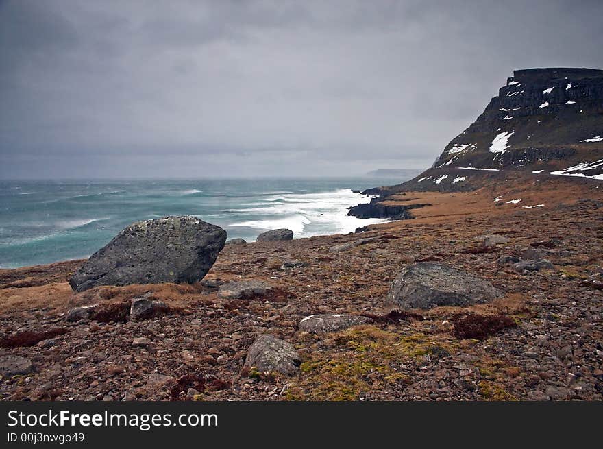 Icelandic landscape with rocks and sea