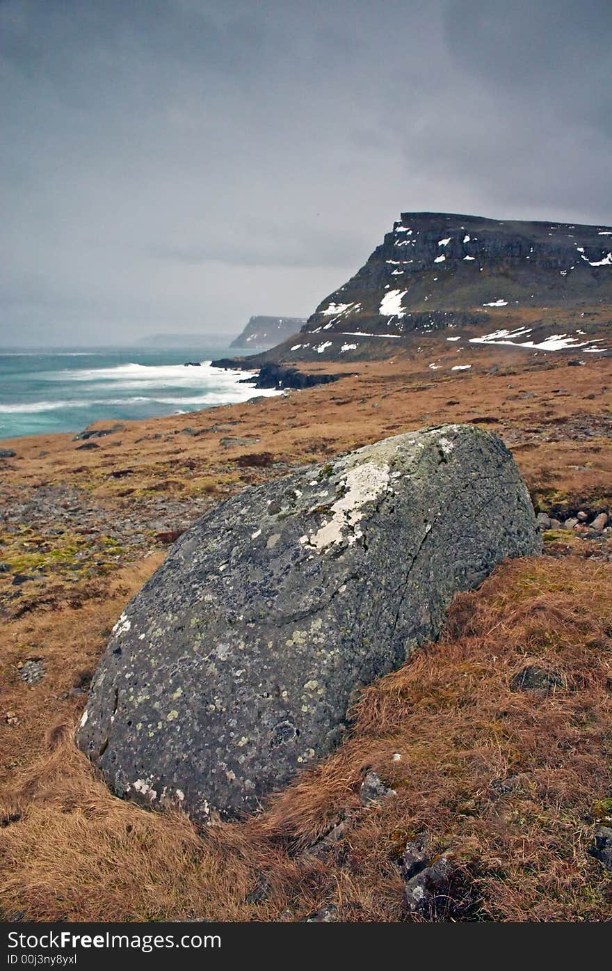 Icelandic landscape with rocks and sea