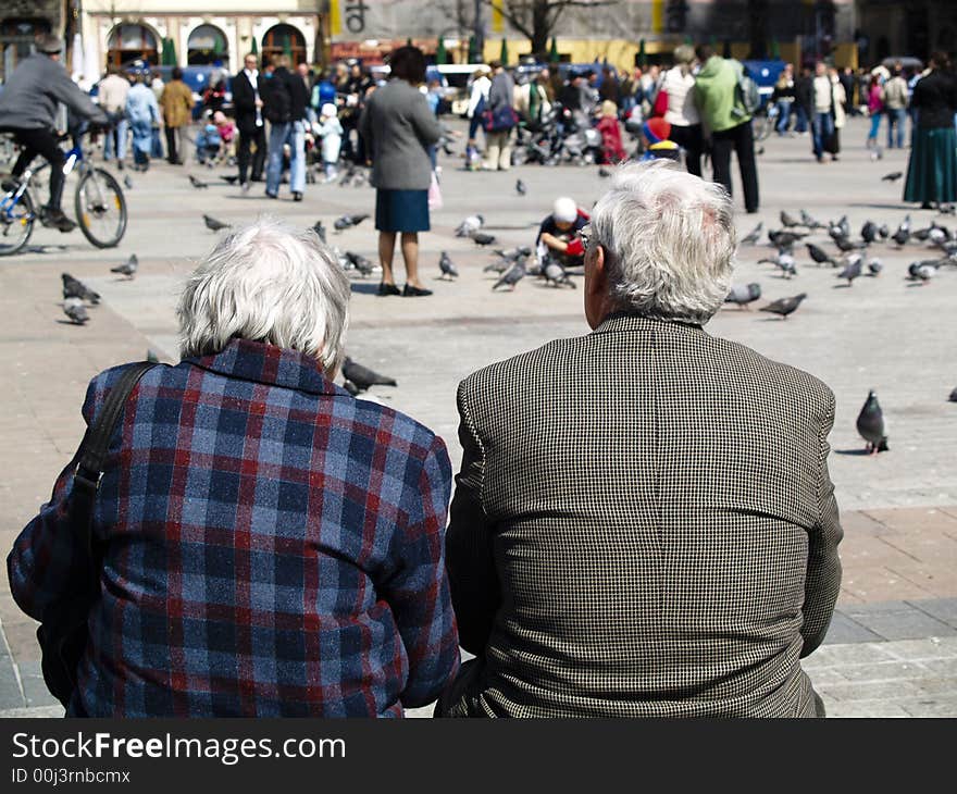 Couple sitting on a bench taking in the view. Couple sitting on a bench taking in the view