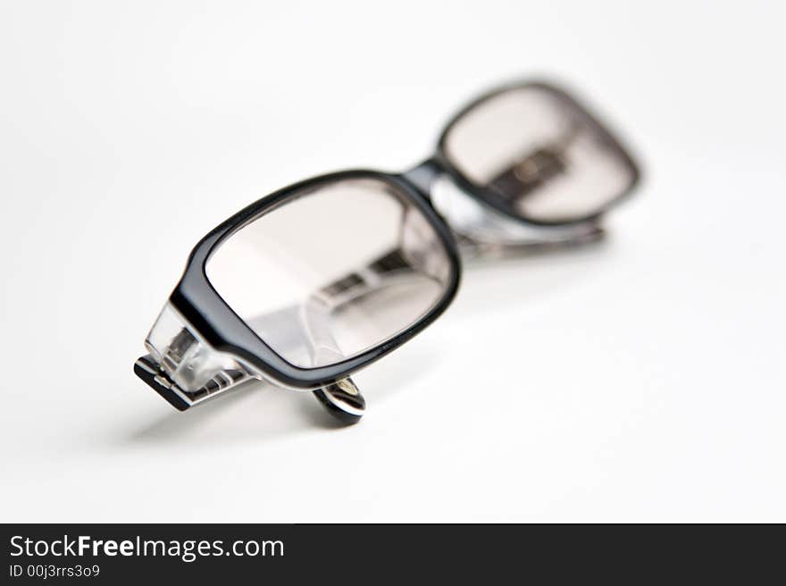 Glasses on a white background, studio shot. Illustration for aging themes. Glasses on a white background, studio shot. Illustration for aging themes.