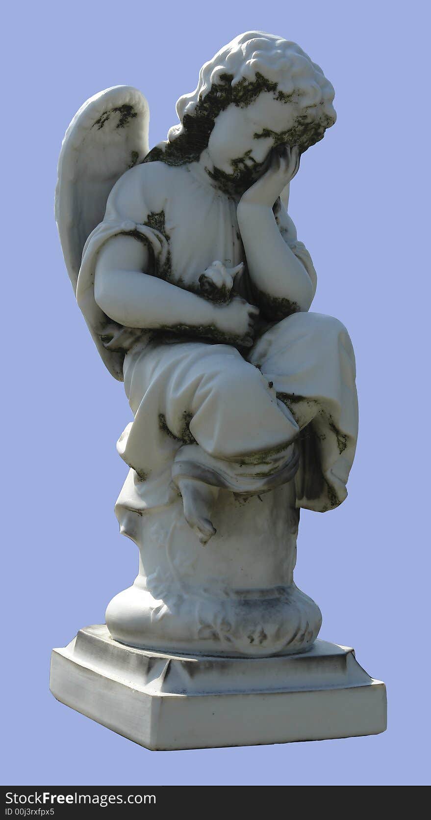 A sculpture of an marble angel sitting on the column. A sculpture of an marble angel sitting on the column