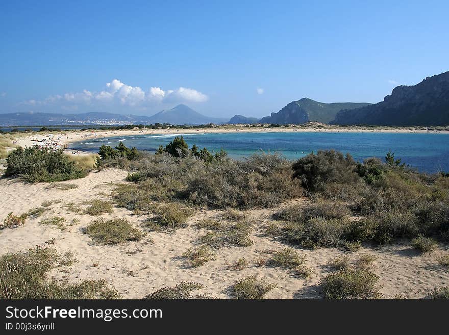 A wide-angle view of Voidokilia beach in Messinia area, Greece; the beach is considered one of the most beautiful in Europe, and its name means Ox belly (from its shape). A wide-angle view of Voidokilia beach in Messinia area, Greece; the beach is considered one of the most beautiful in Europe, and its name means Ox belly (from its shape)