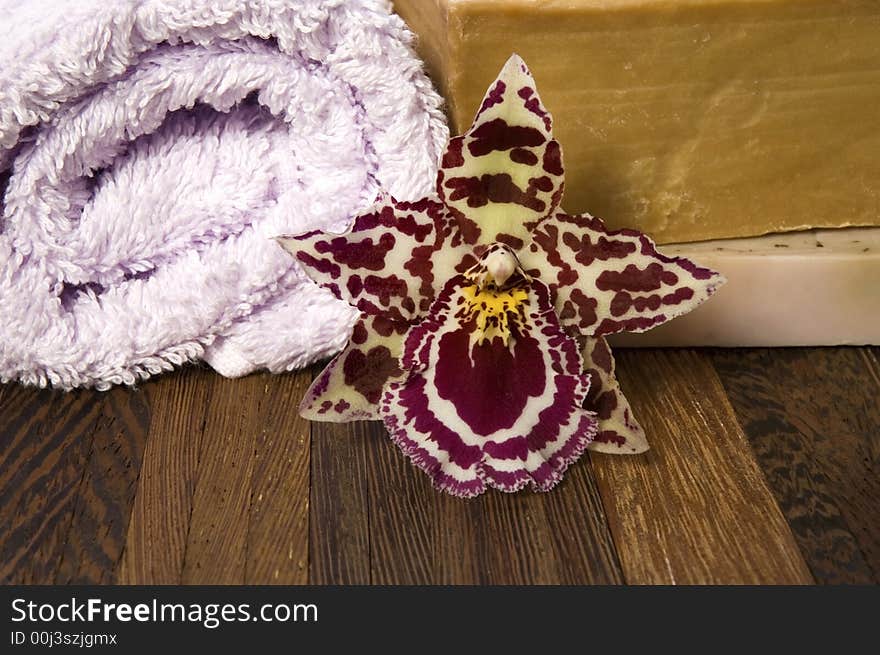 Aroma bath items. towel, soap and orchid. Aroma bath items. towel, soap and orchid