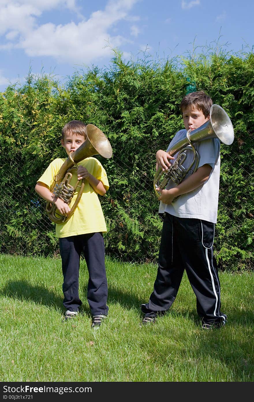 Brothers Playing On The  Horn