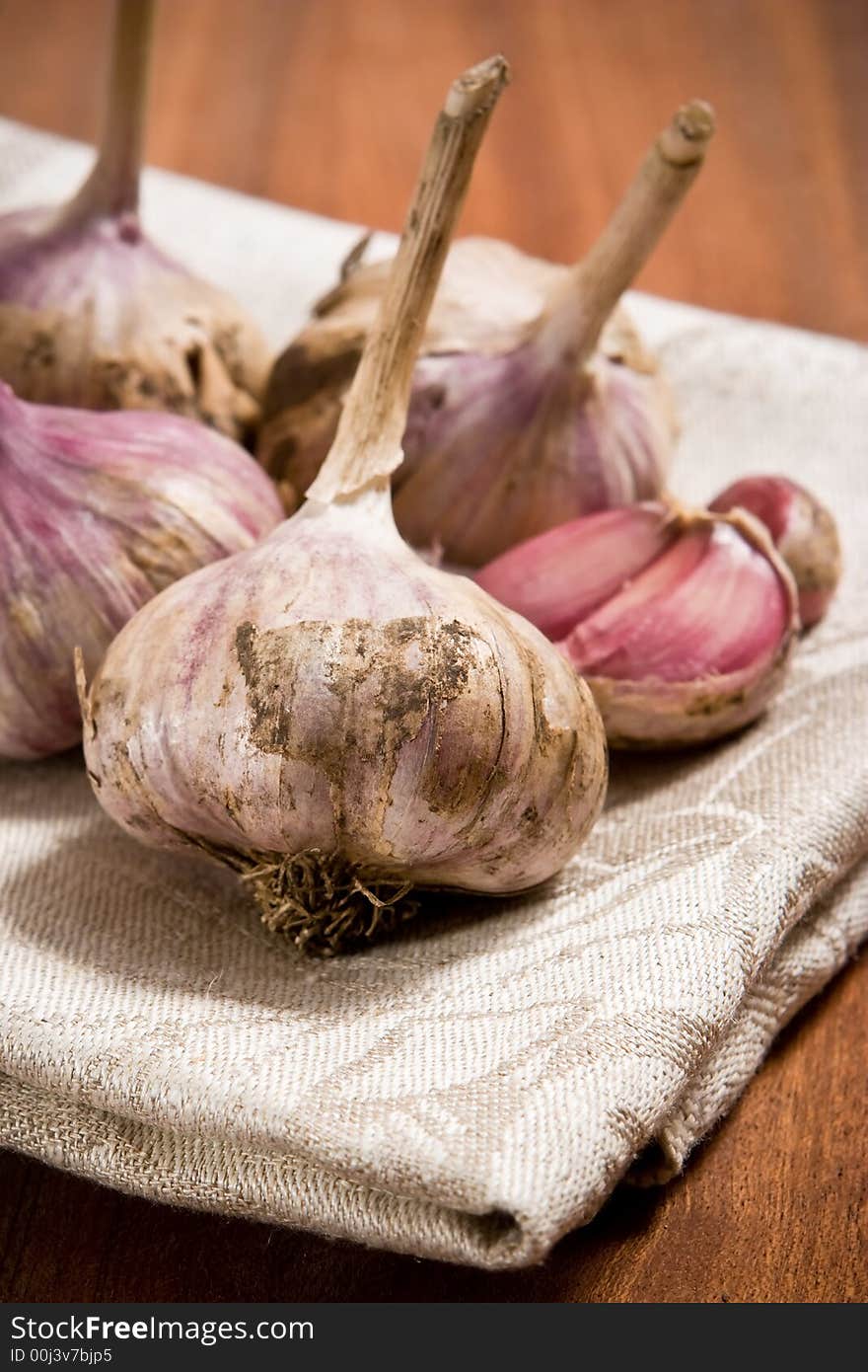 Fresh garlic on grey cloth background