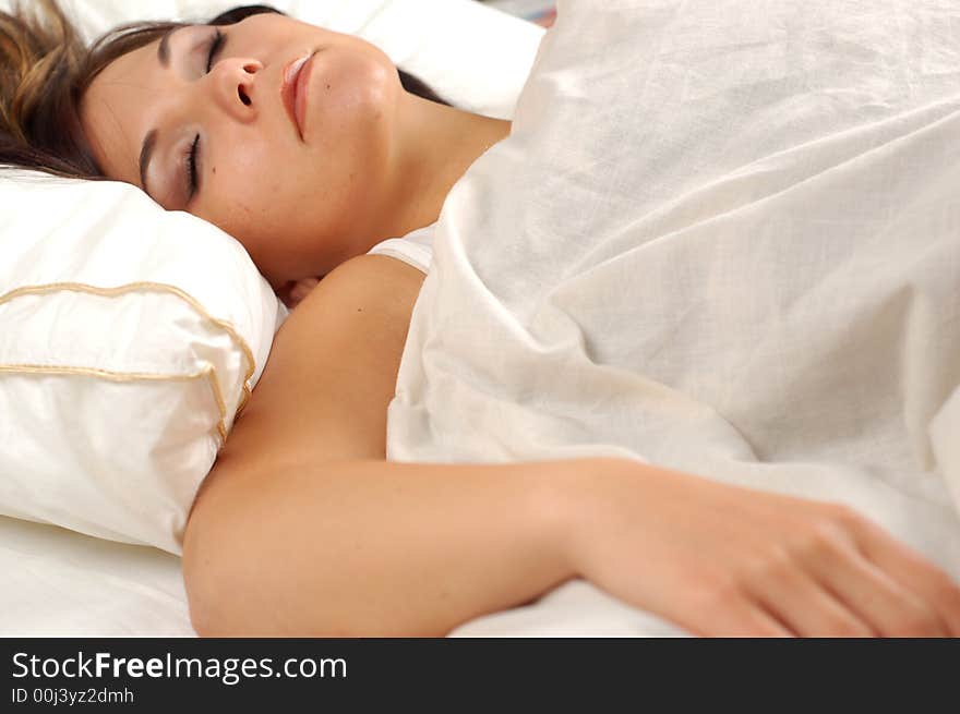 Close-up of attractive brunette woman in bed. Close-up of attractive brunette woman in bed