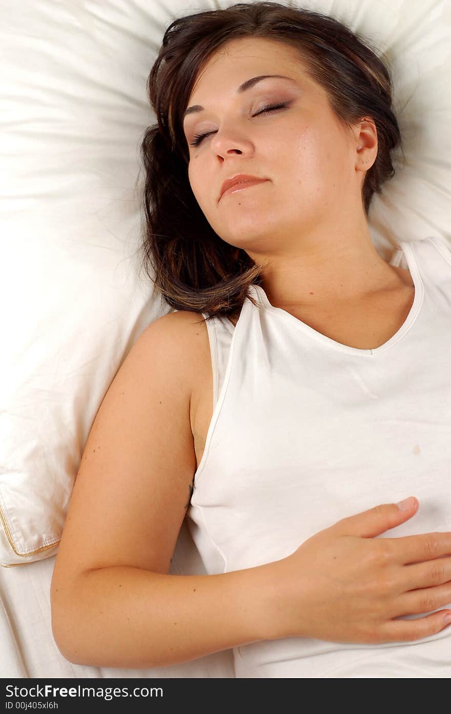 Close-up of attractive brunette woman in bed. Close-up of attractive brunette woman in bed