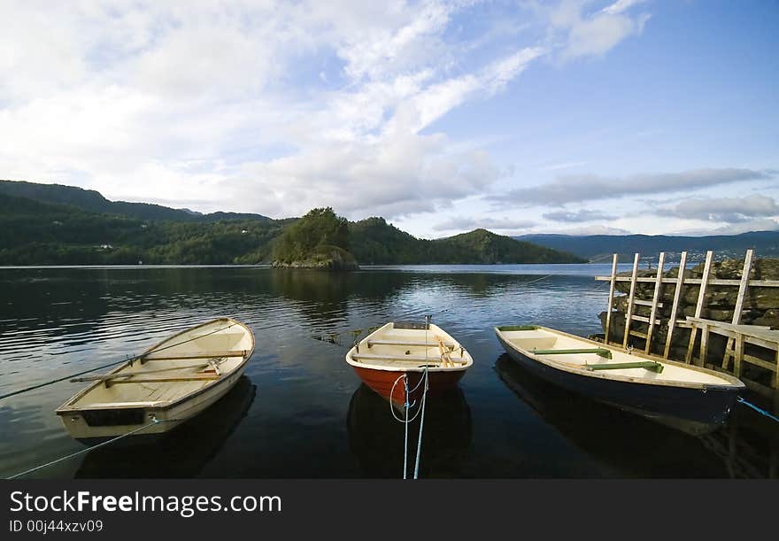 Three boats moored, a wooden jetty at the right, fjord, Norway, Hordaland.

<a href='http://www.dreamstime.com/sea-fishing-rcollection7072-resi208938' STYLE='font-size:13px; text-decoration: blink; color:#FF0000'><b>SEA FISHING COLLECTION »</b></a>. Three boats moored, a wooden jetty at the right, fjord, Norway, Hordaland.

<a href='http://www.dreamstime.com/sea-fishing-rcollection7072-resi208938' STYLE='font-size:13px; text-decoration: blink; color:#FF0000'><b>SEA FISHING COLLECTION »</b></a>