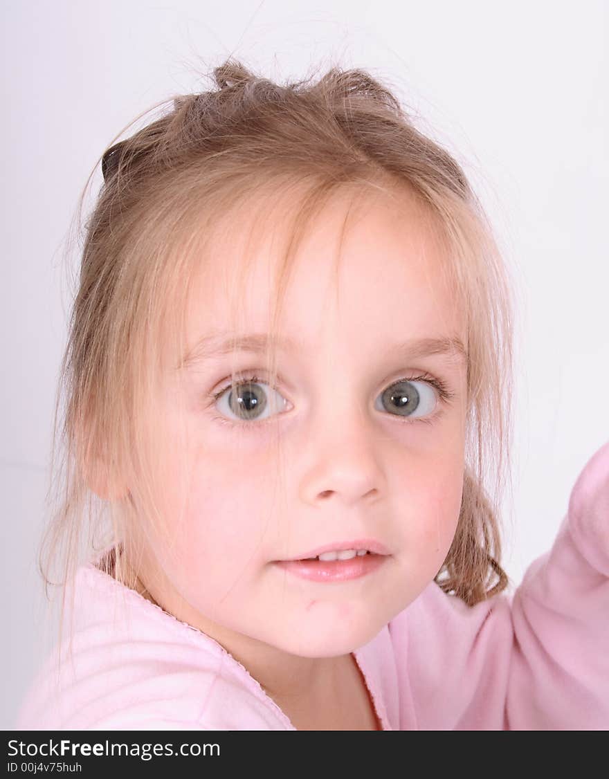 Portrait of young girl in the pink clothes