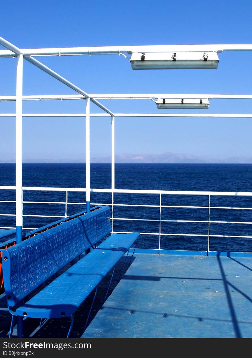 Blue ferry boat bench at sea. Blue ferry boat bench at sea