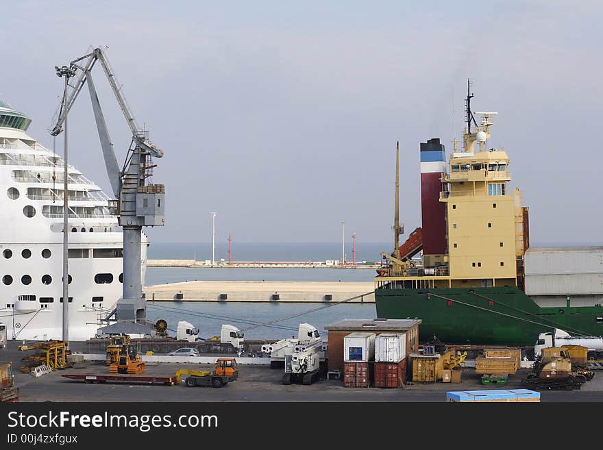 Freight ship being loaded on dockside