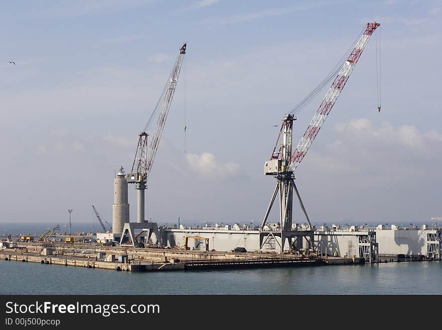 Loading cranes on dockside, livorno Italy