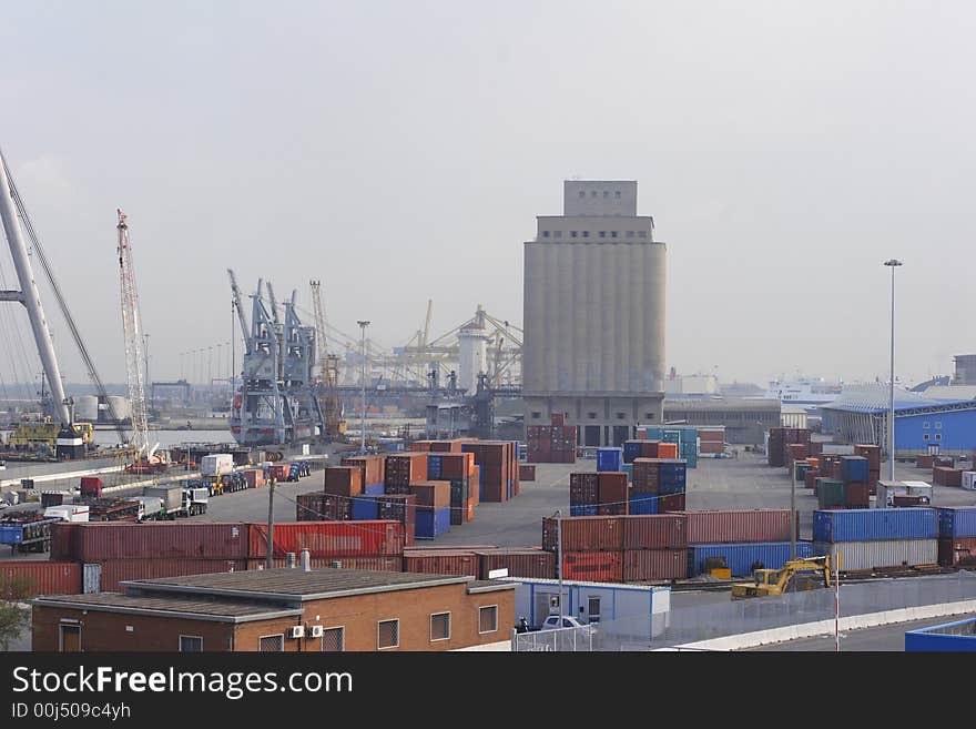 Freight containers on dockside waiting to be loaded on ship