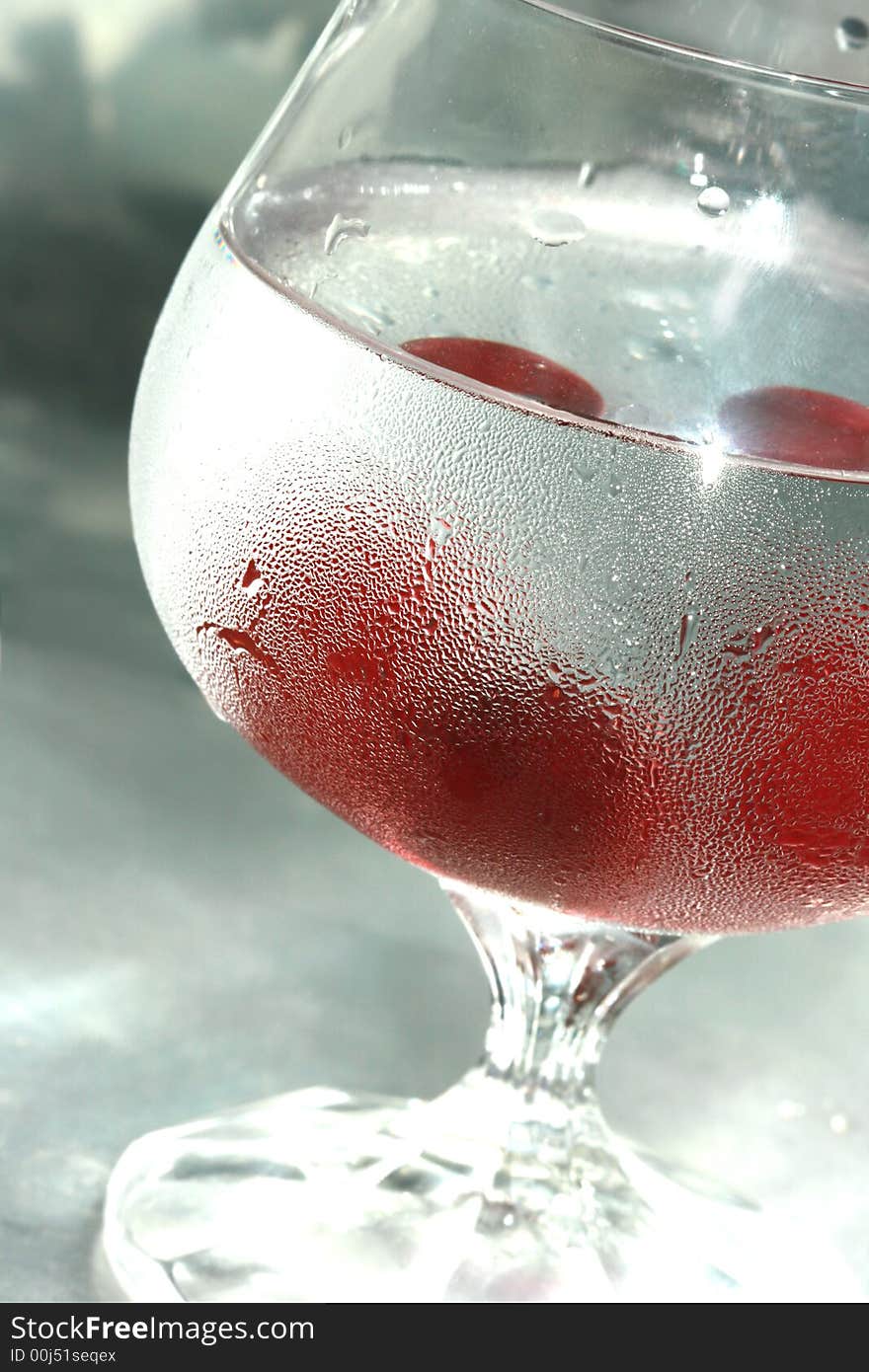 Cherry in glass of mineral water. Cherry in glass of mineral water