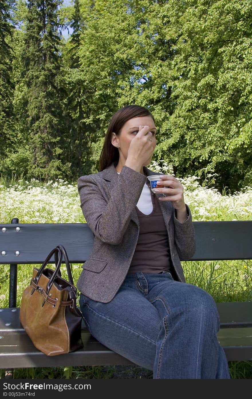 Business lunch in the park, young woman. Business lunch in the park, young woman