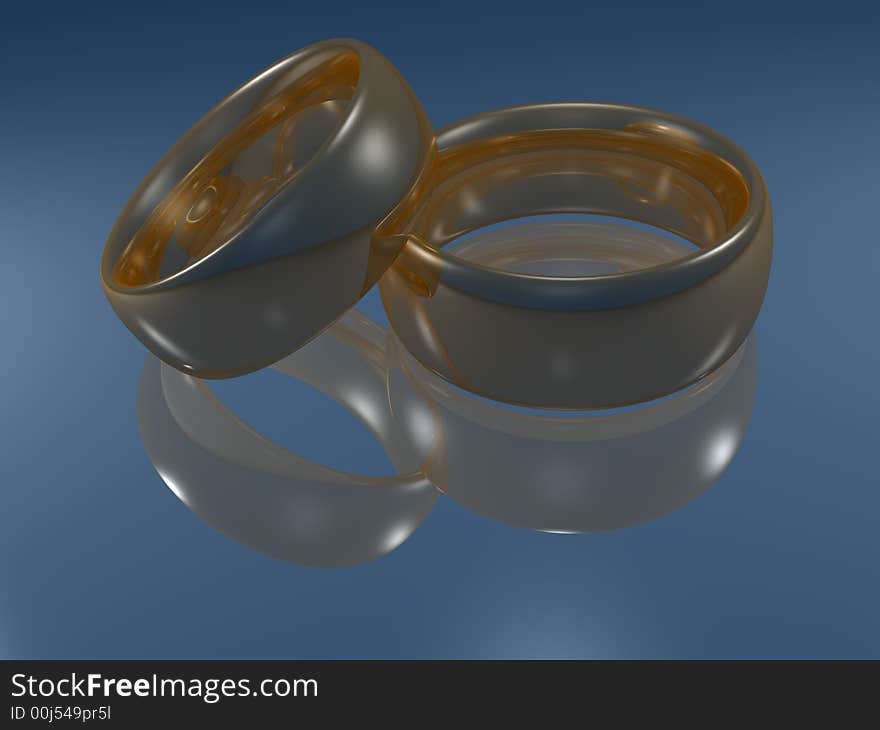 Weddings golden rings on reflective surface. Weddings golden rings on reflective surface