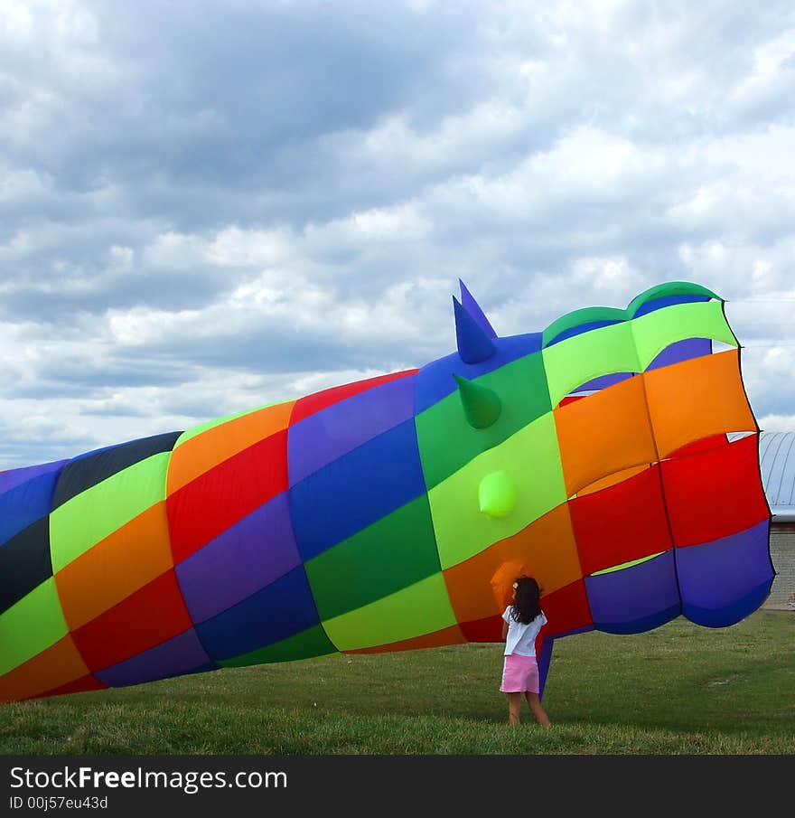 Girl Examines Colorful Wind So